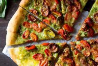 Rustic Basil Pesto Pizza with Sweet Roasted Tomatoes and Melted Mozzarella