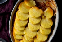 Rich Beef and Sausage Ragu over Creamy Baked Polenta