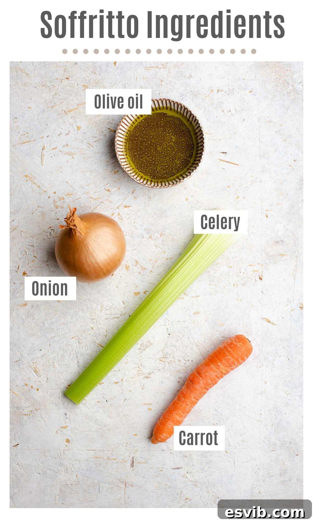 The Art of Perfect Soffritto 3 An overhead shot showing all of the ingredients you need to make Italian soffritto: a carrot, a celery stalk, an onion, and a bottle of olive oil