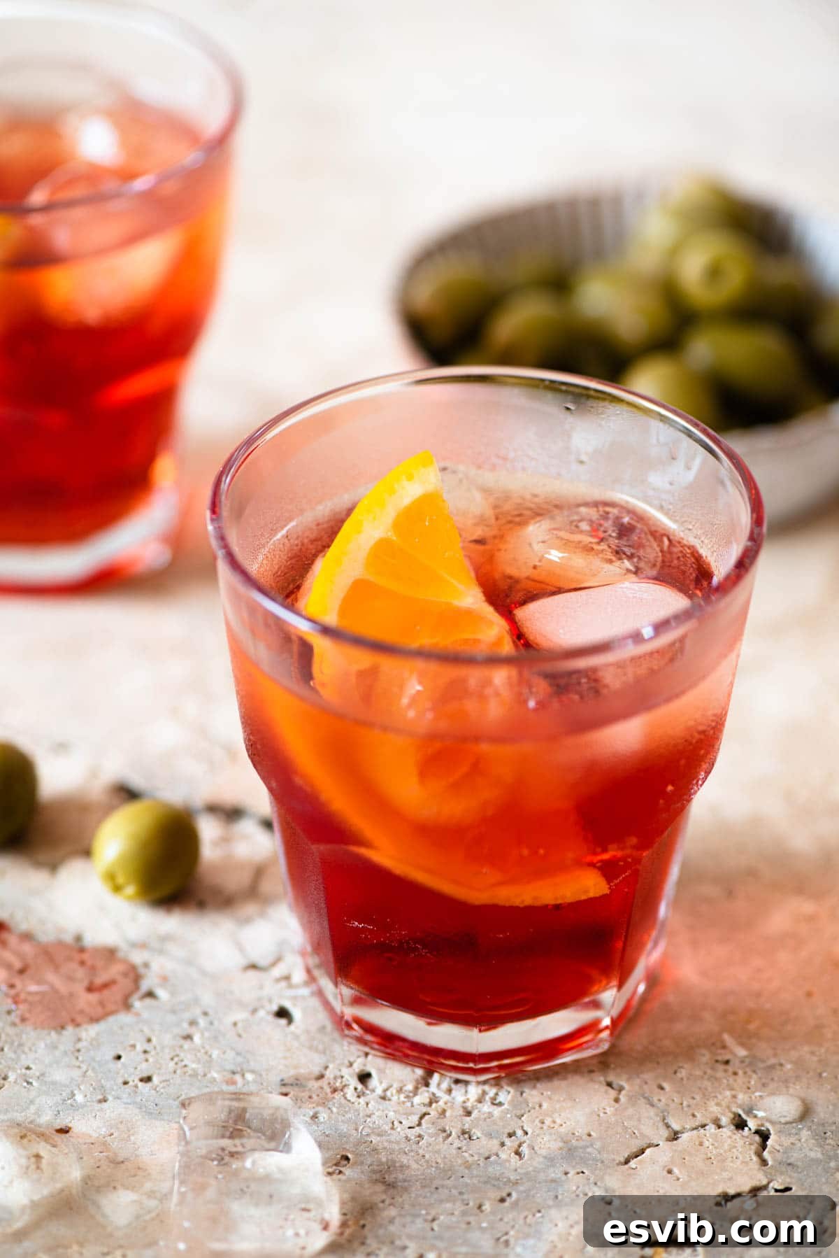 Effervescent Italian Aperitivo 5 A close up of an Americano cocktail with a slice of orange