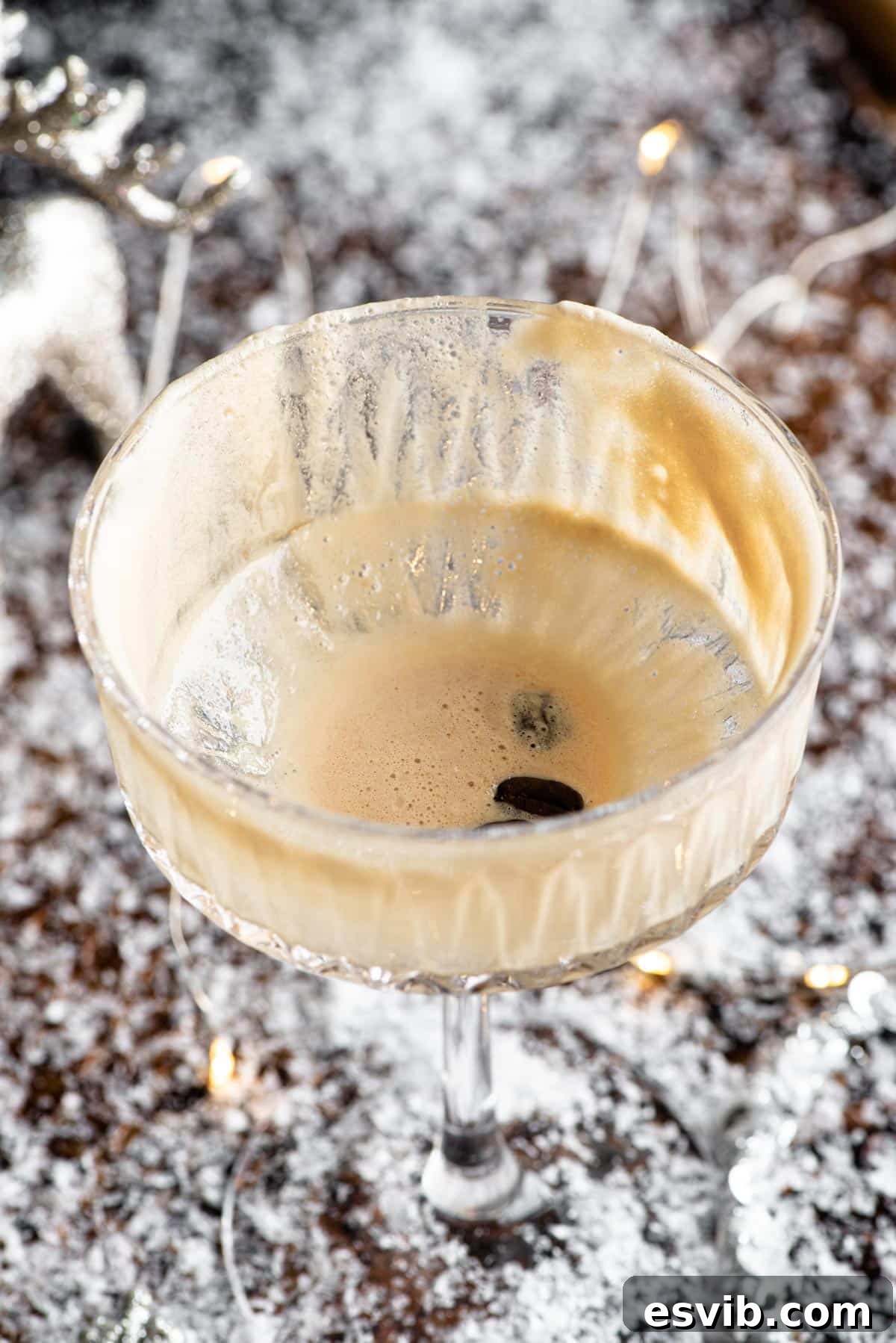 A close up of an empty martini macchiato cocktail glass, ready for another delicious serving.