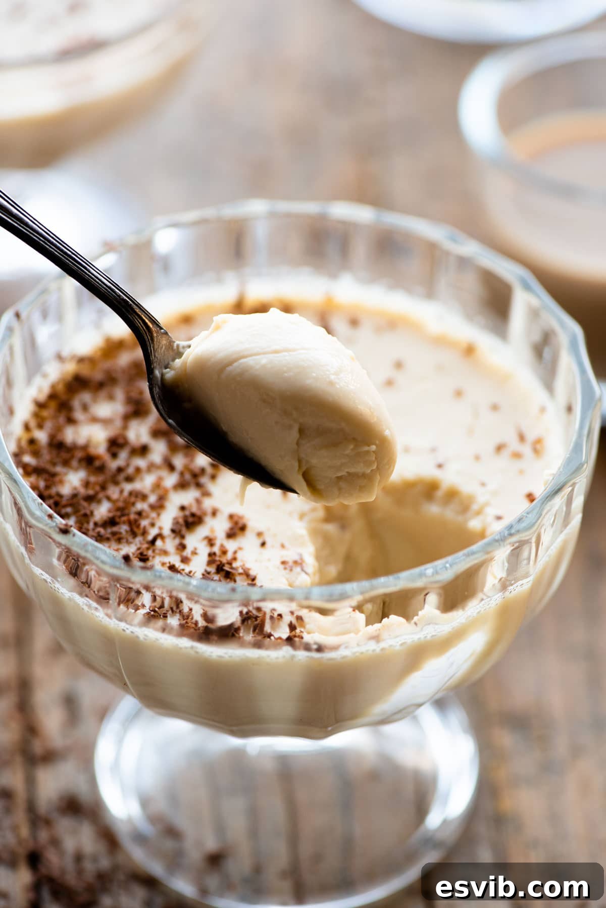 Bailey's Velvet Panna Cotta 6 A close-up shot of a spoonful of rich and creamy Bailey's Panna Cotta, highlighting its smooth texture and tempting appearance.