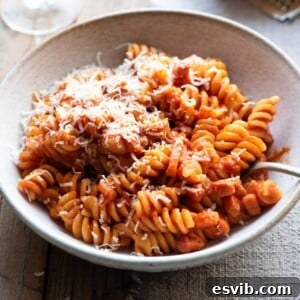 A close up of a creamy tomato pasta in a bowl