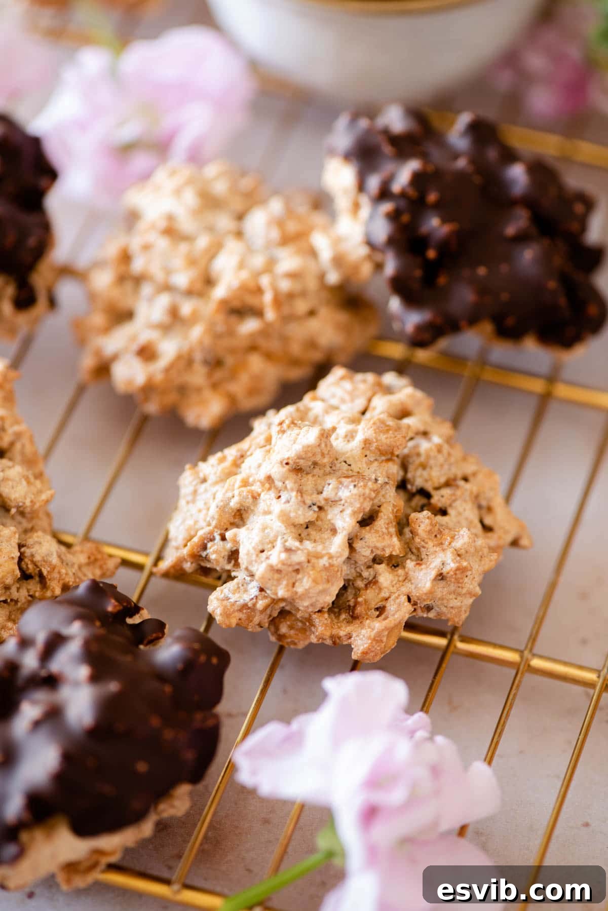 A close up of golden Brutti ma Buoni cookies arranged on a gold cooling rack, highlighting their unique texture and color.