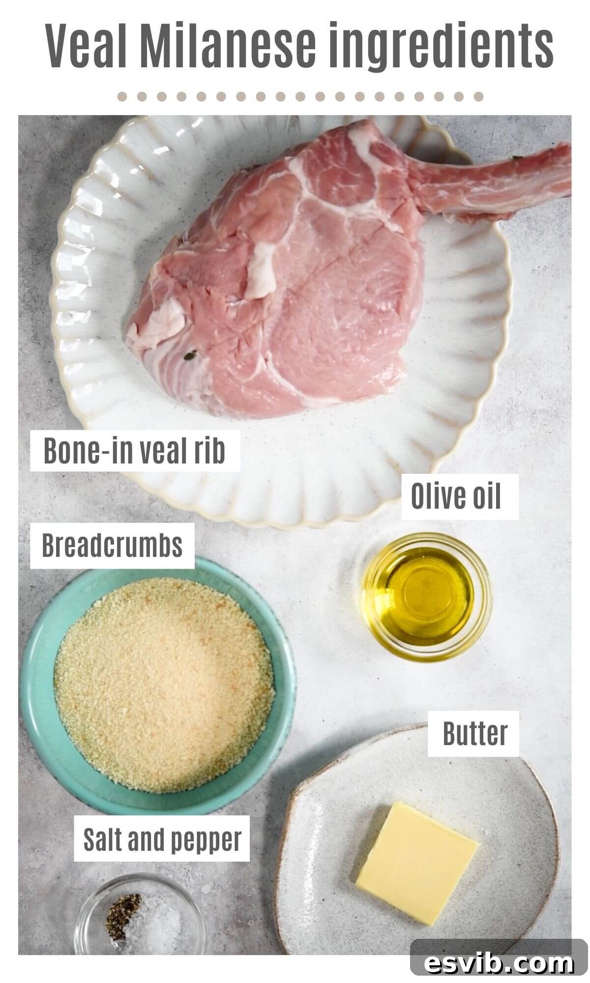 An overhead shot displaying all the fresh ingredients required to prepare Veal Milanese: veal chops, breadcrumbs, butter, olive oil, and lemons.