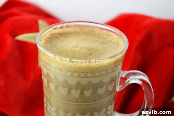 Delicious Warm Banana Milk Coffee - Perfect for Fall A close-up shot of a single mug of banana milk coffee, perfectly frothed and ready to be enjoyed.