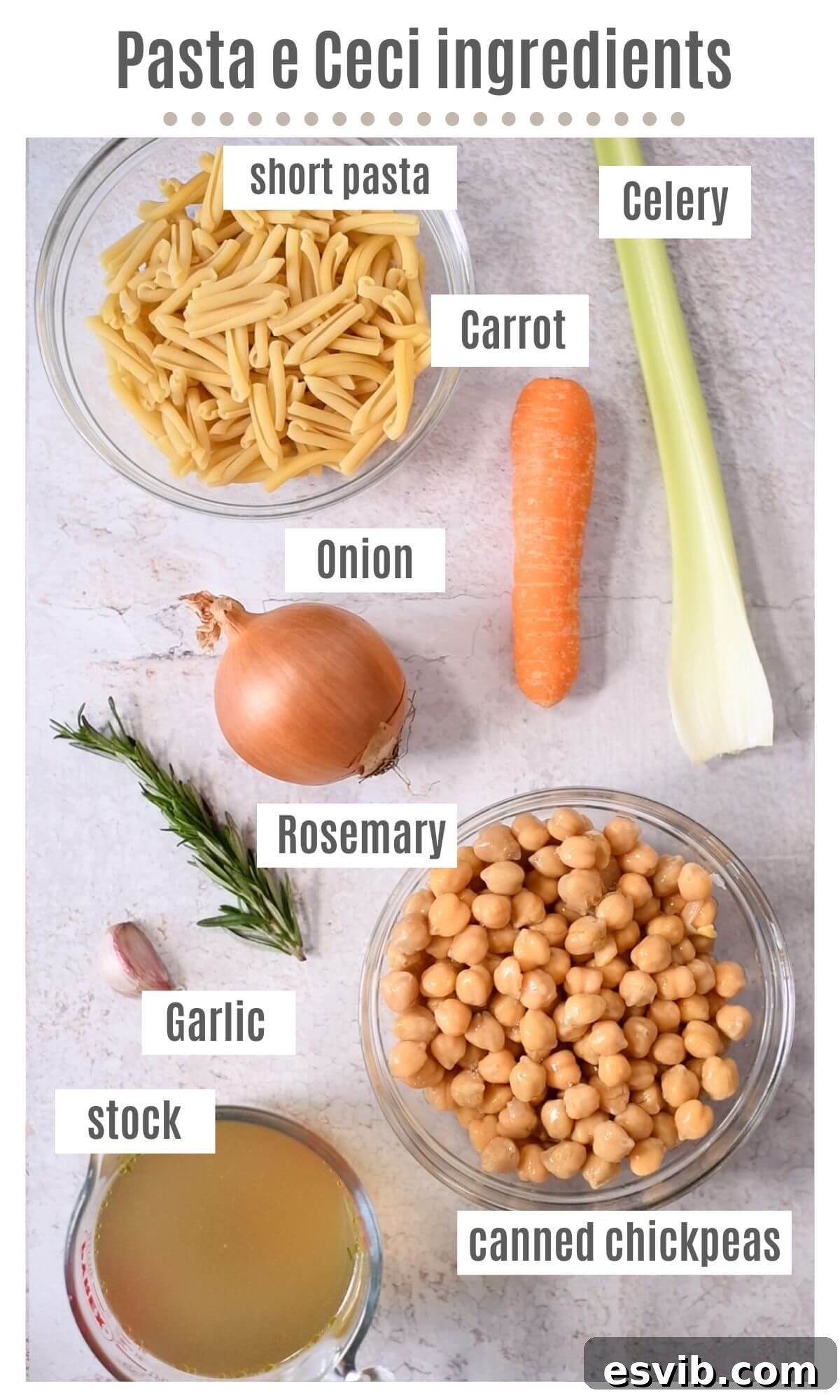 An overhead shot displaying all the fresh and simple ingredients required to prepare a delicious Pasta e Ceci (Italian pasta with chickpeas) soup, neatly arranged on a rustic wooden surface.