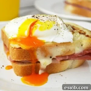 Croque Madame - mustard and ham toasts topped with a cheesy bechamel sauce and a perfectly cooked poached egg. Breakfast heaven.