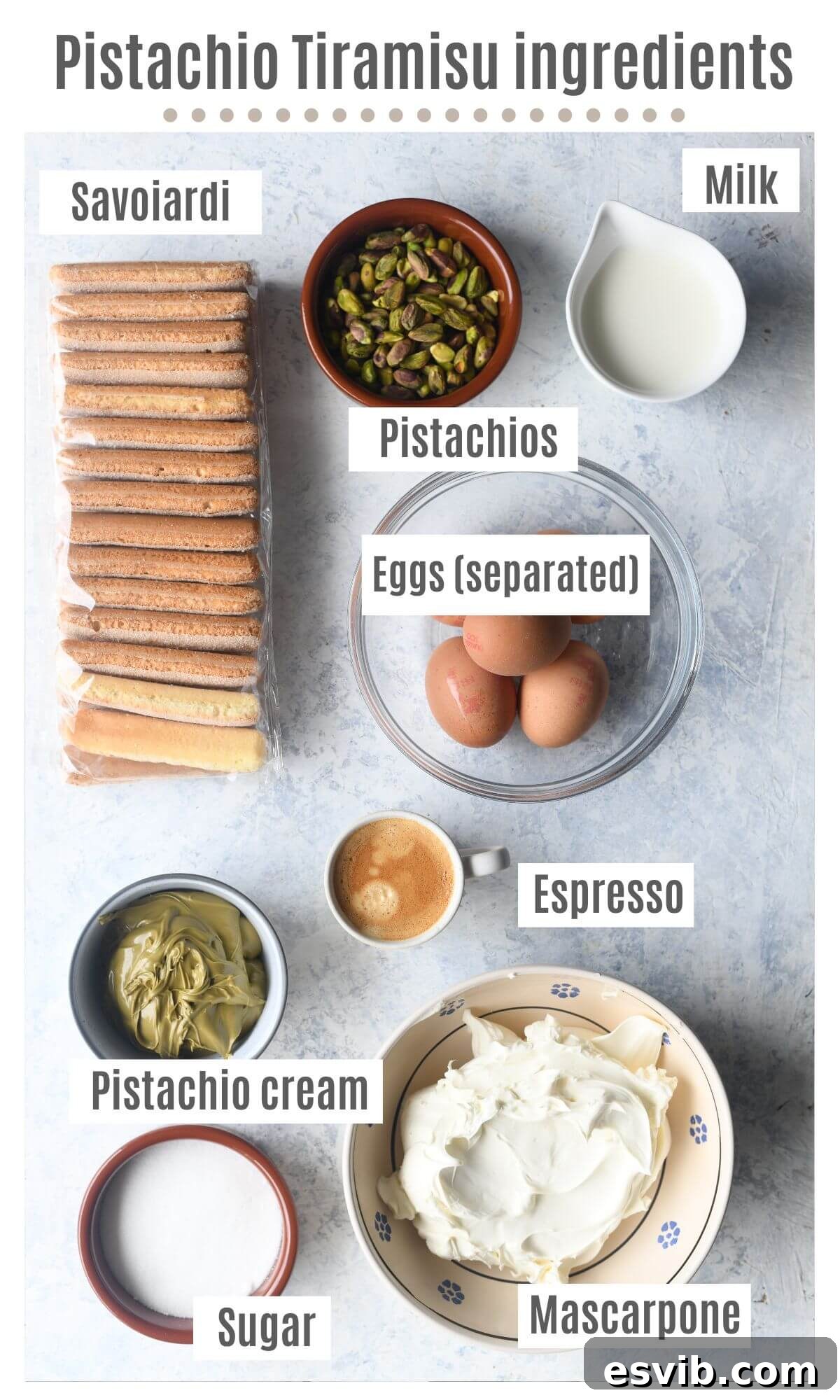 An overhead shot of all the ingredients neatly arranged on a wooden surface, ready to make Pistachio Tiramisu.