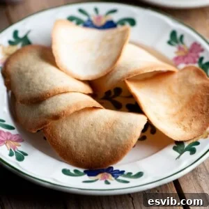 A close up of Tegole Valdostane (Italian cookies) on a plate.