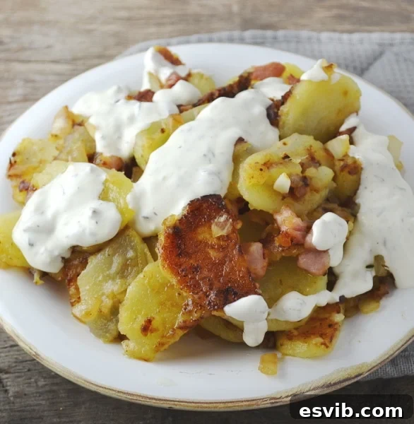 Bratkartoffeln, crispy fried potatoes with smoked pancetta and sweet white onion topped with an incredible garlic and herb sauce. It's SO GOOD! Insidetherustickitchen.com Bratkartoffeln, crispy fried potatoes with smoked pancetta and sweet white onion topped with an incredible garlic and herb sauce. It's SO GOOD! Insidetherustickitchen.com