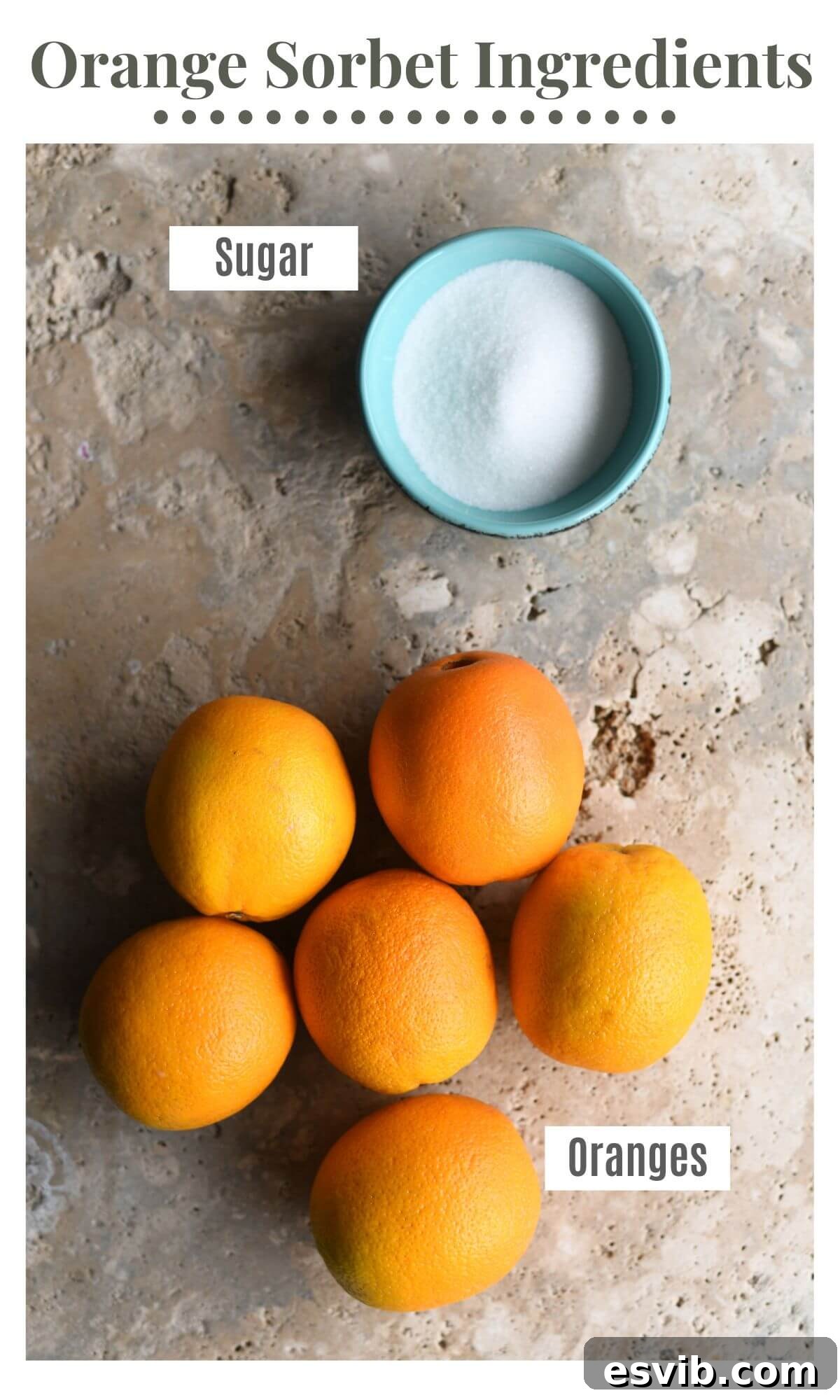 An overhead shot showcasing the only two ingredients needed to make orange sorbet: fresh, ripe oranges and a bowl of white granulated sugar.