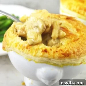 Individual chicken and mushroom pie in a small dish
