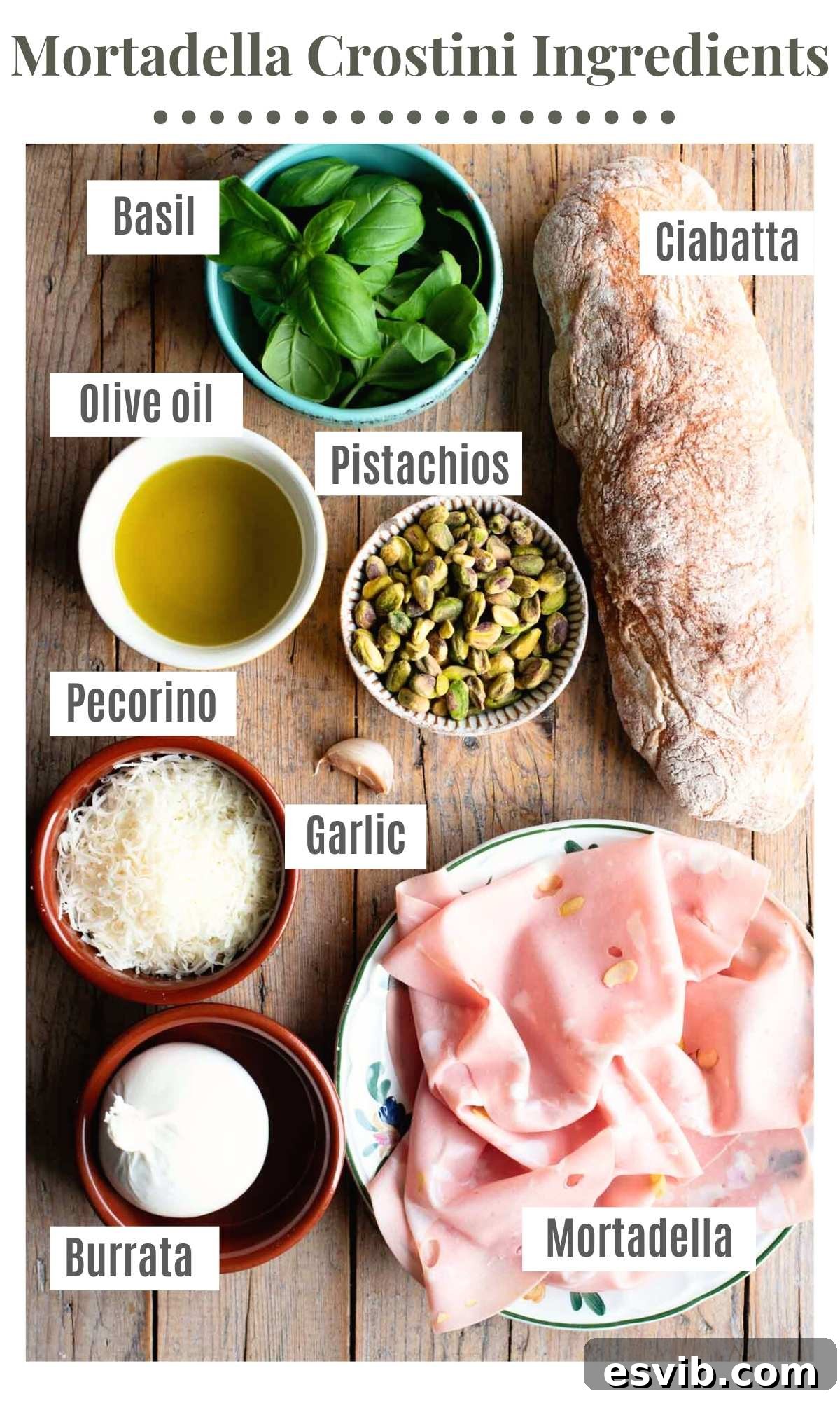 Pistachio-Crusted Mortadella and Burrata Crostini 3 An overhead shot of all the fresh ingredients needed to make mortadella crostini with pistachio pesto and burrata, artfully arranged on a rustic wooden board.
