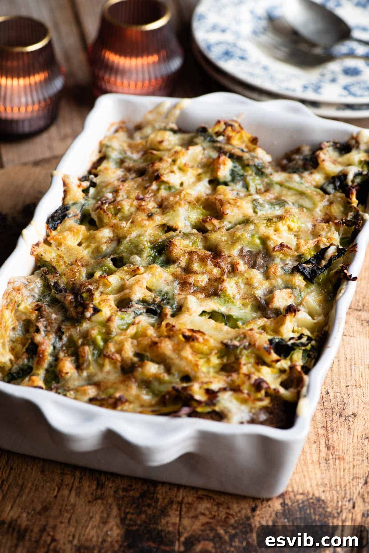 Hearty Alpine Cabbage and Cheese Bake 6 A golden-brown Zuppa alla Valpellinese, baked to perfection in a rustic baking dish, resting on a wooden board.