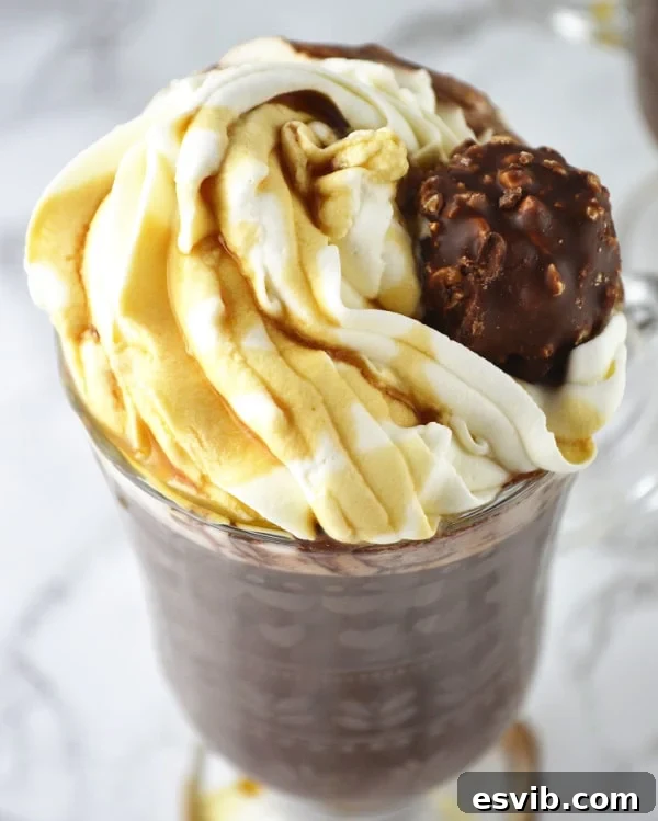 Rich Baileys Hot Chocolate topped with Maple Whipped Cream and Ferrero Rocher