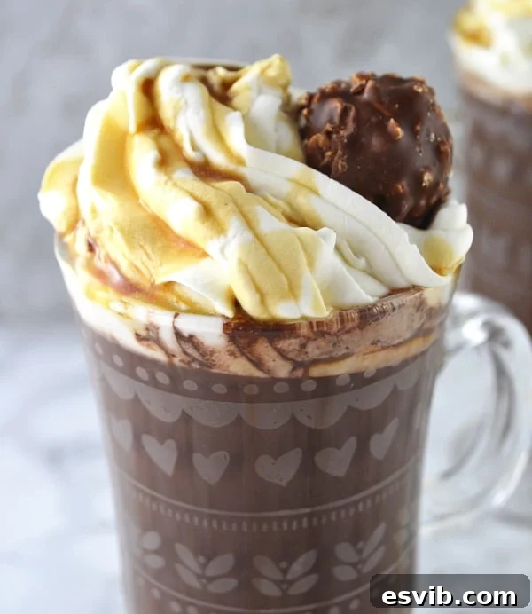 Close-up of Baileys Hot Chocolate with Maple Whipped Cream being prepared