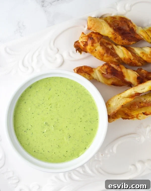 Creamy Sour Cream Pesto Dip served with crispy Prosciutto Dippers, perfect for parties.