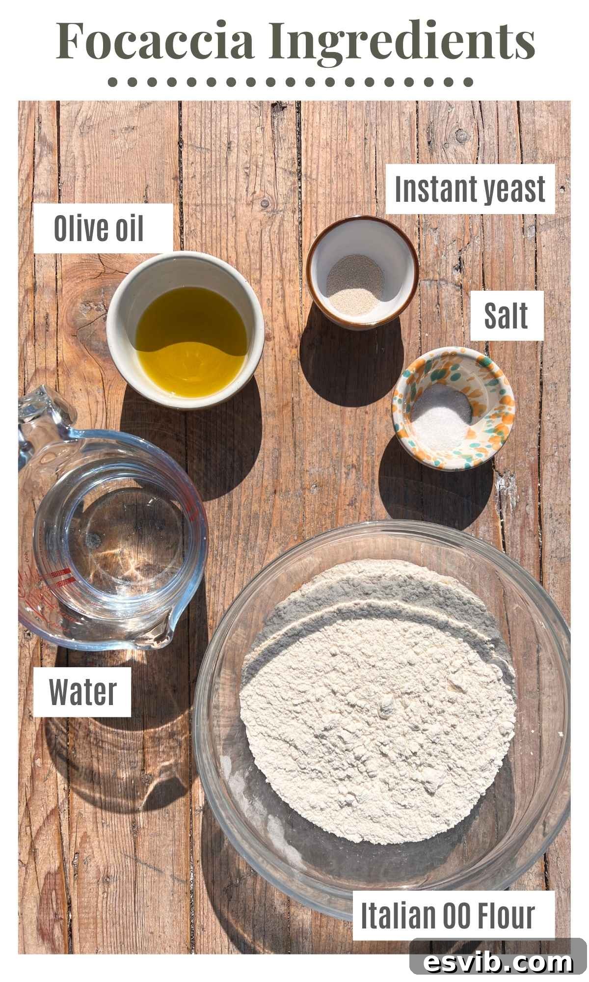 All the ingredients needed to make a focaccia laid out on a rustic wooden surface.