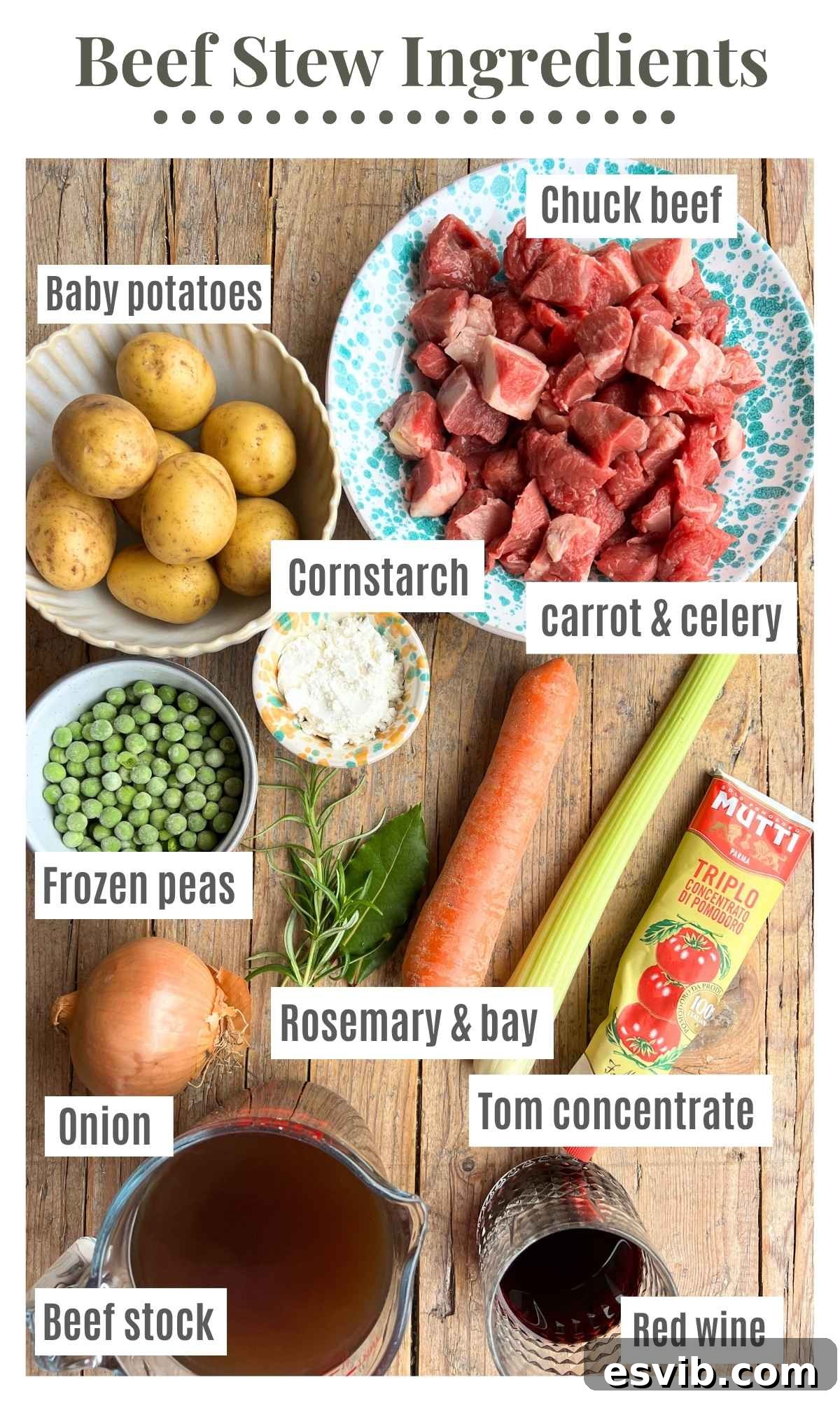 A beautifully arranged flat lay of all the essential ingredients for making an authentic Italian beef stew. Items include cubed chuck beef, finely chopped carrots, celery, and onion, vibrant baby potatoes, frozen peas, rich tomato concentrate, a bottle of red wine, and savory beef stock, all carefully labeled on a rustic wooden board, ready for cooking.