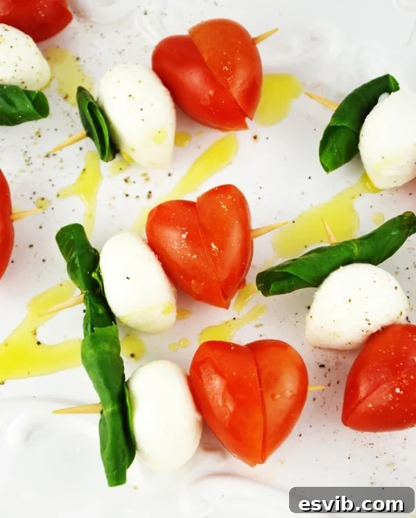 Valentine's Caprese Skewers - an easy and classic Italian appetizer, perfect for romantic dinners. www.insidetherustickitchen.com