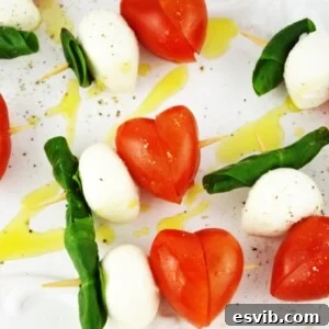 These fun Valentine's Caprese Skewers are a perfect fuss free appetizer using classic Italian ingredients you can't go wrong! www.insidetherustickitchen.com