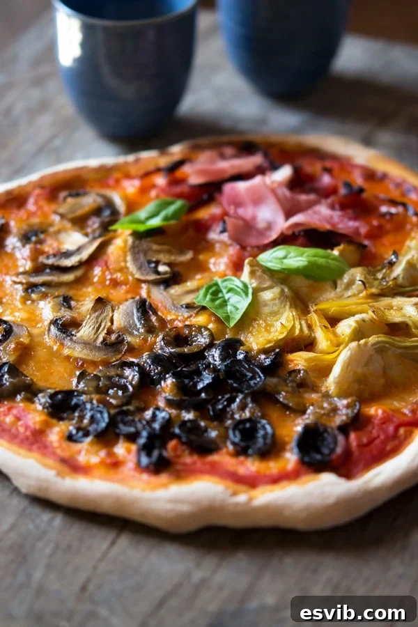 Close-up of a freshly baked Quattro Stagioni Pizza, highlighting the melted cheese and vibrant toppings.