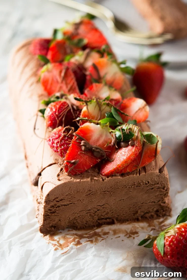A close up of a chocolate semifreddo topped with strawberries, an easy semifreddo recipe