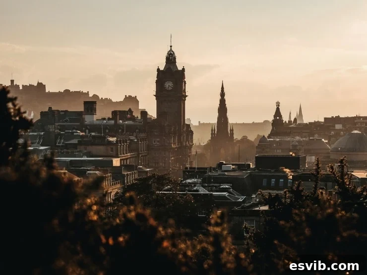 A stunning wide shot of Edinburgh city at dawn, showcasing its iconic architecture and capturing the tranquil beauty of the Scottish capital.