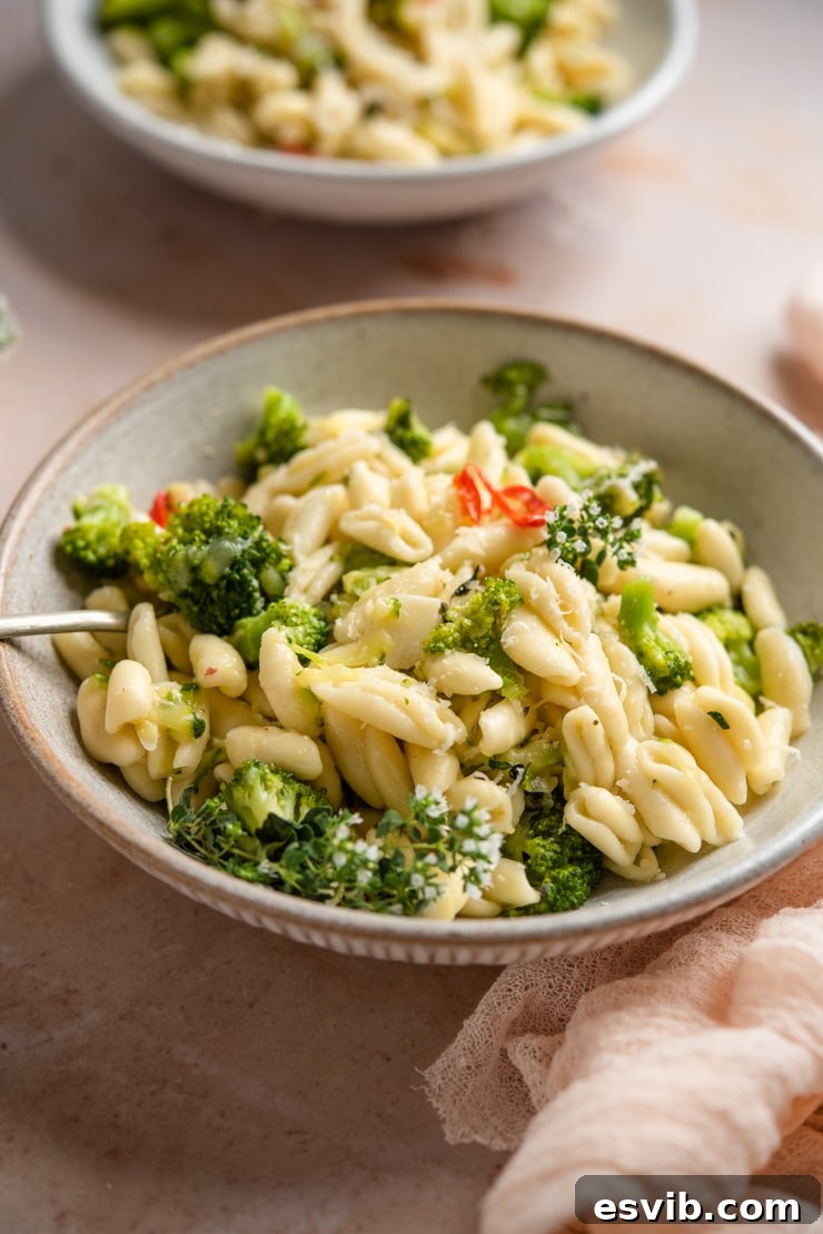 A close-up of cavatelli and broccoli pasta in a rustic bowl, ready to be served