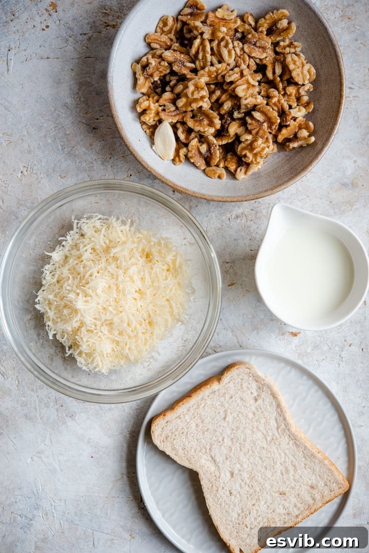 An overhead shot showcasing all the fresh ingredients needed for making creamy Italian walnut sauce.
