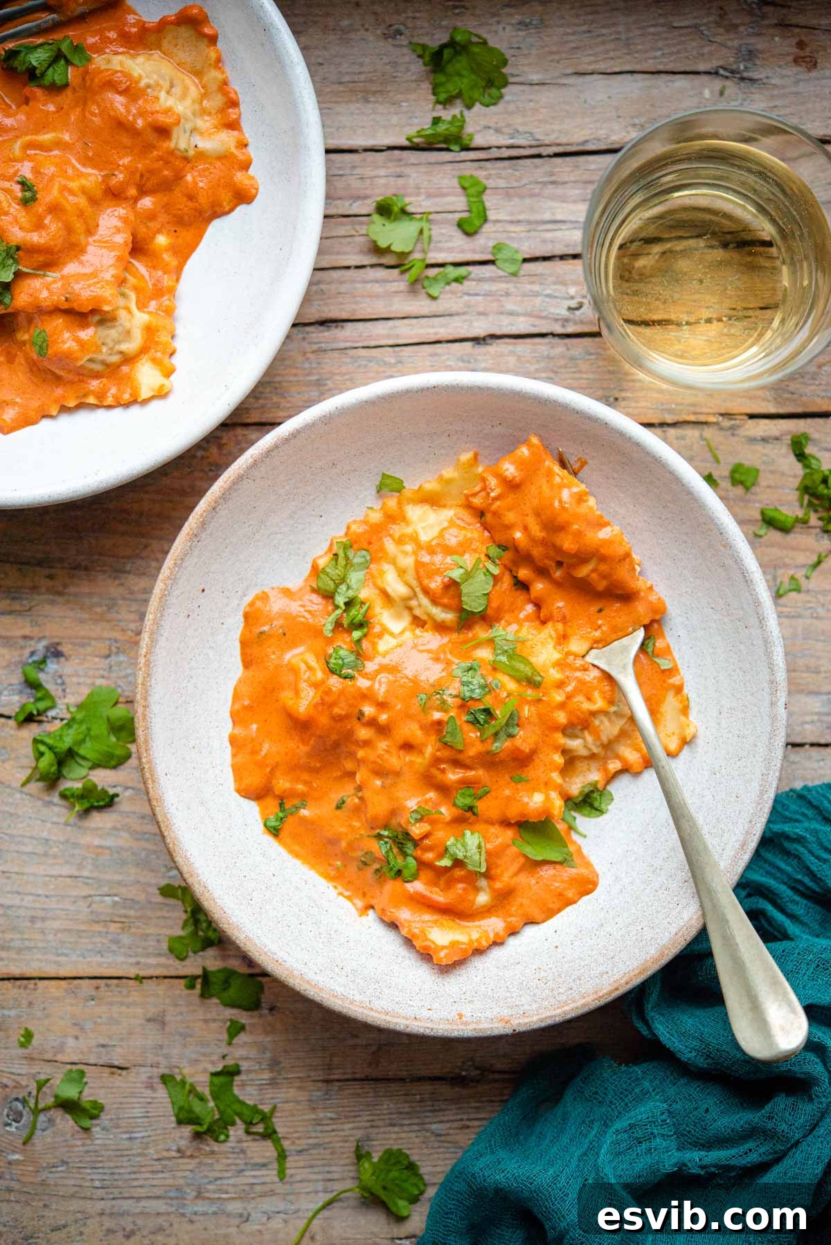 Decadent Lobster Ravioli with Velvety Vodka Sauce 2 An overhead shot of lobster ravioli in a bowl, garnished with fresh herbs