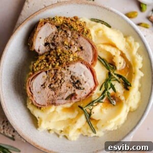 A square image of the finished Stuffed Pork Tenderloin dish, showing a golden crust and savory filling, perfect for a gourmet meal.