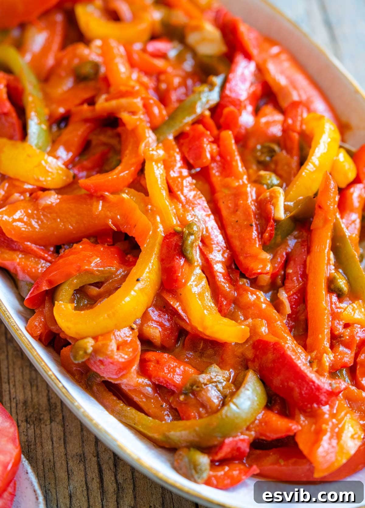 La Peperonata Italian Pepper Medley 3 A close-up view of the rich texture of bell peppers slow-cooked in a vibrant tomato sauce