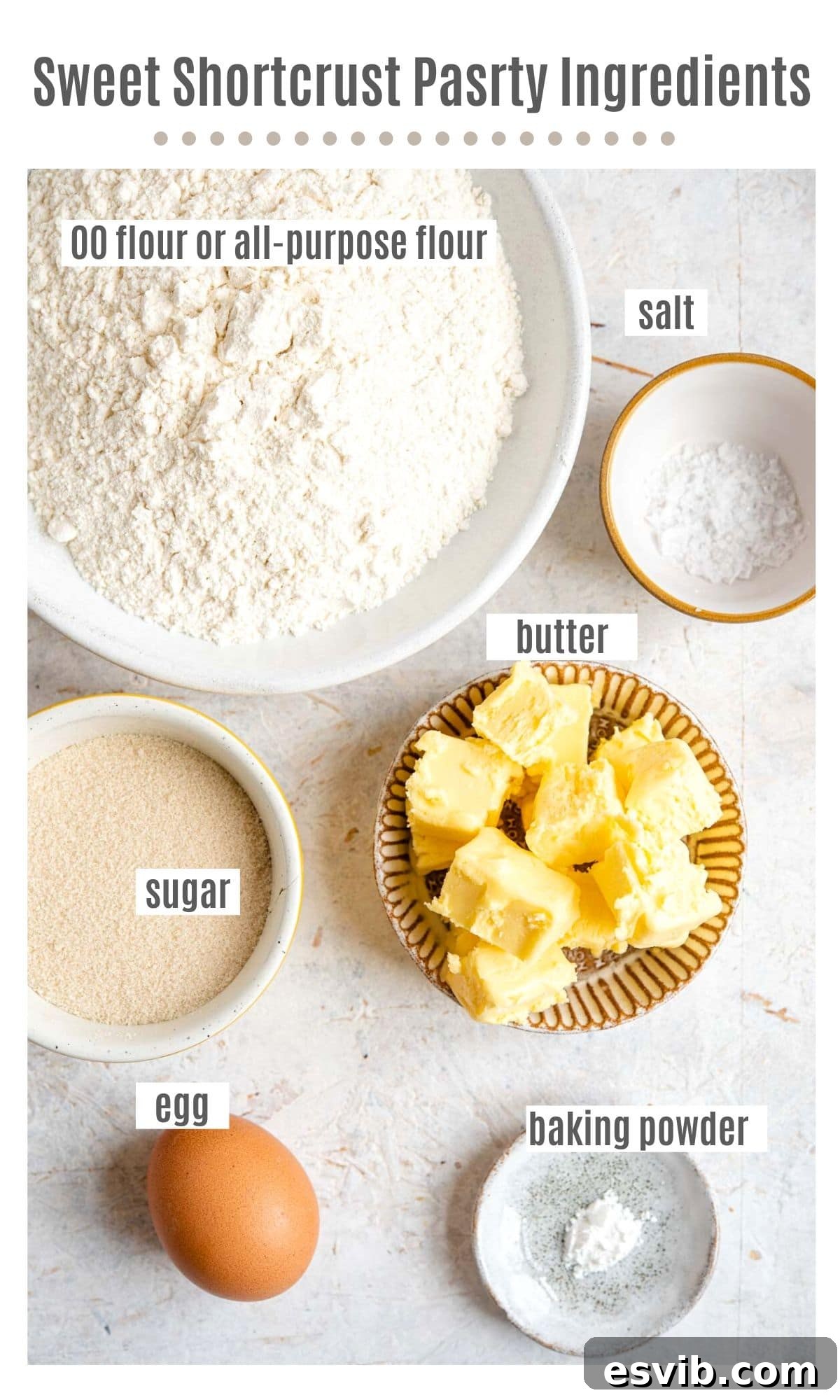 All the core ingredients for Italian sweet shortcrust pastry laid out on a kitchen surface.