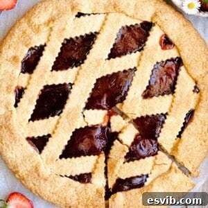 Classic Italian Jam Crostata 8 A square photo of a freshly baked Italian crostata with a golden lattice top, ready to be served.
