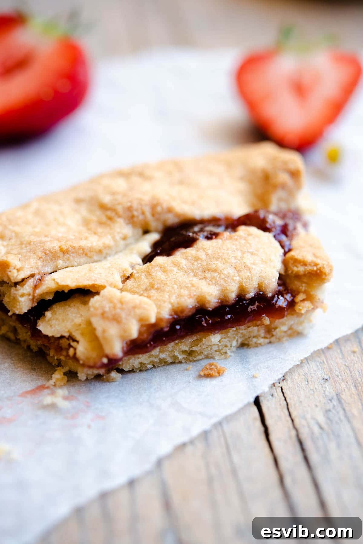 Classic Italian Jam Crostata 7 A close-up shot of a perfectly cut slice of Italian crostata, with its flaky pastry and luscious jam filling clearly visible.