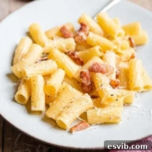 A square photo of pasta alla gricia