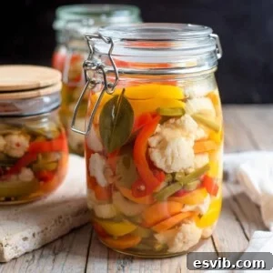 A close up of a jar of giardiniera vegetables