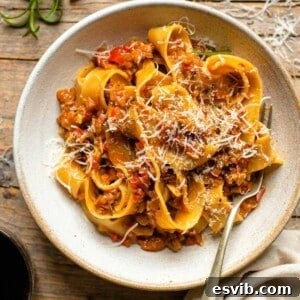 An overhead shot of a bowl of vegetable ragu and pasta