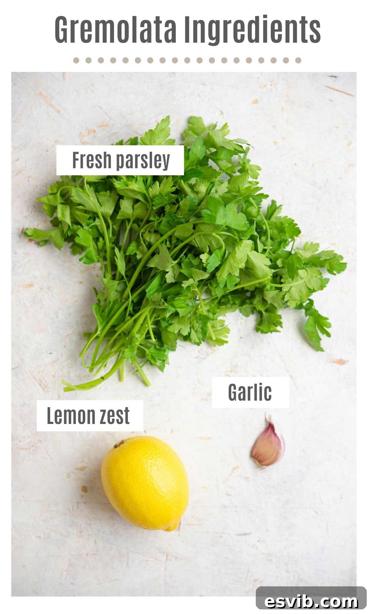 Zesty Italian Herb Gremolata 3 An overhead shot showing the three core ingredients for Gremolata laid out: a bunch of fresh flat-leaf parsley, whole garlic cloves, and a whole lemon.