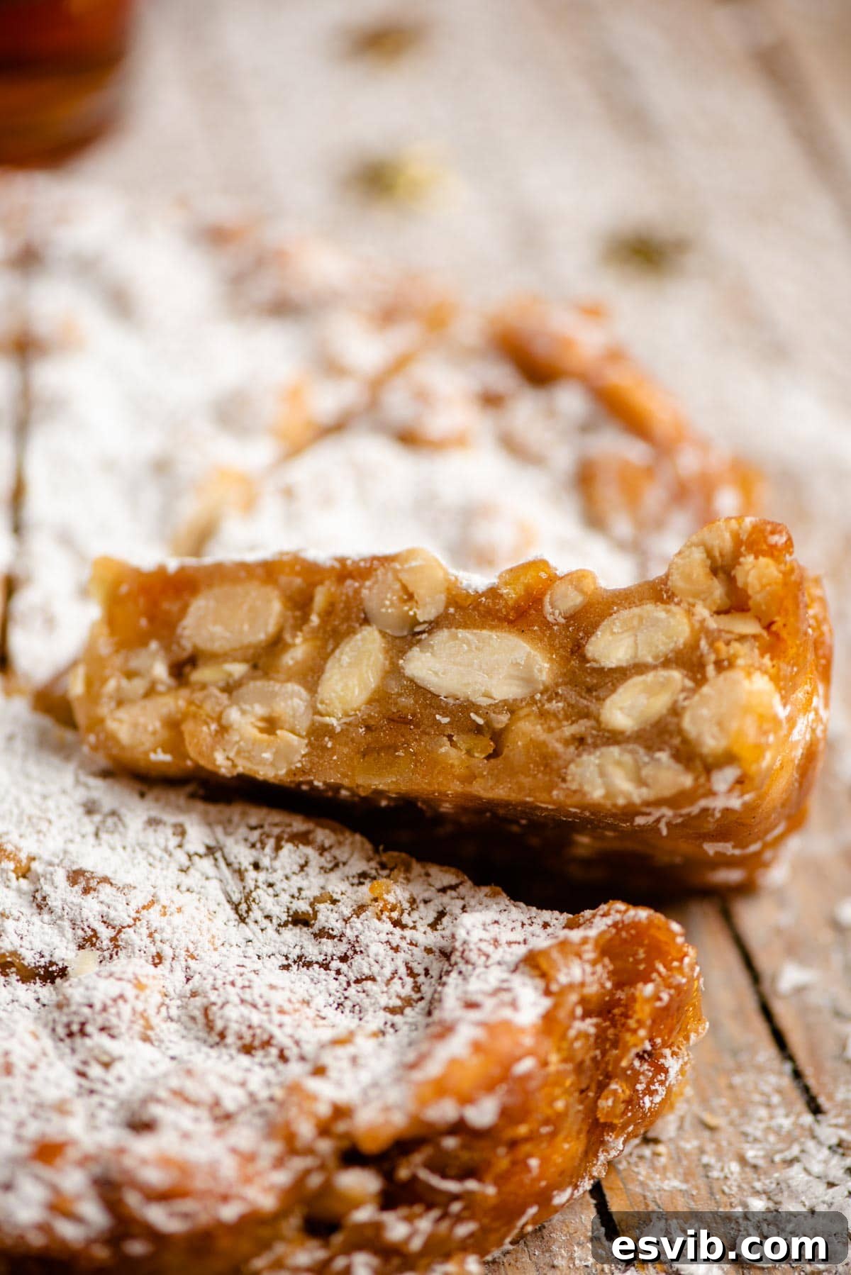Panforte: Tuscany's Rich Fruit and Nut Confection 6 A close up of a cut slice on panforte showing all the nuts and fruit inside