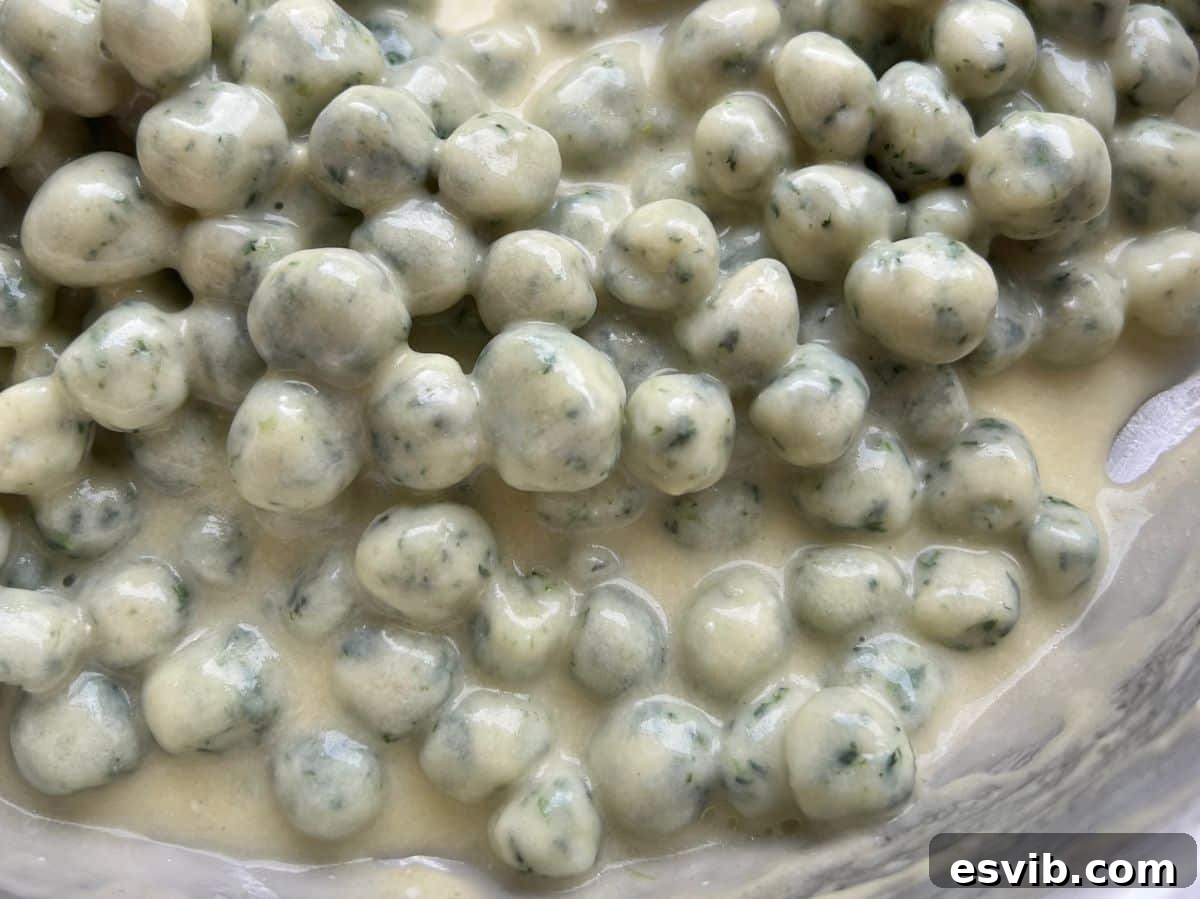A close up of the creamy parmigiano and butter sauce with gnocchette.