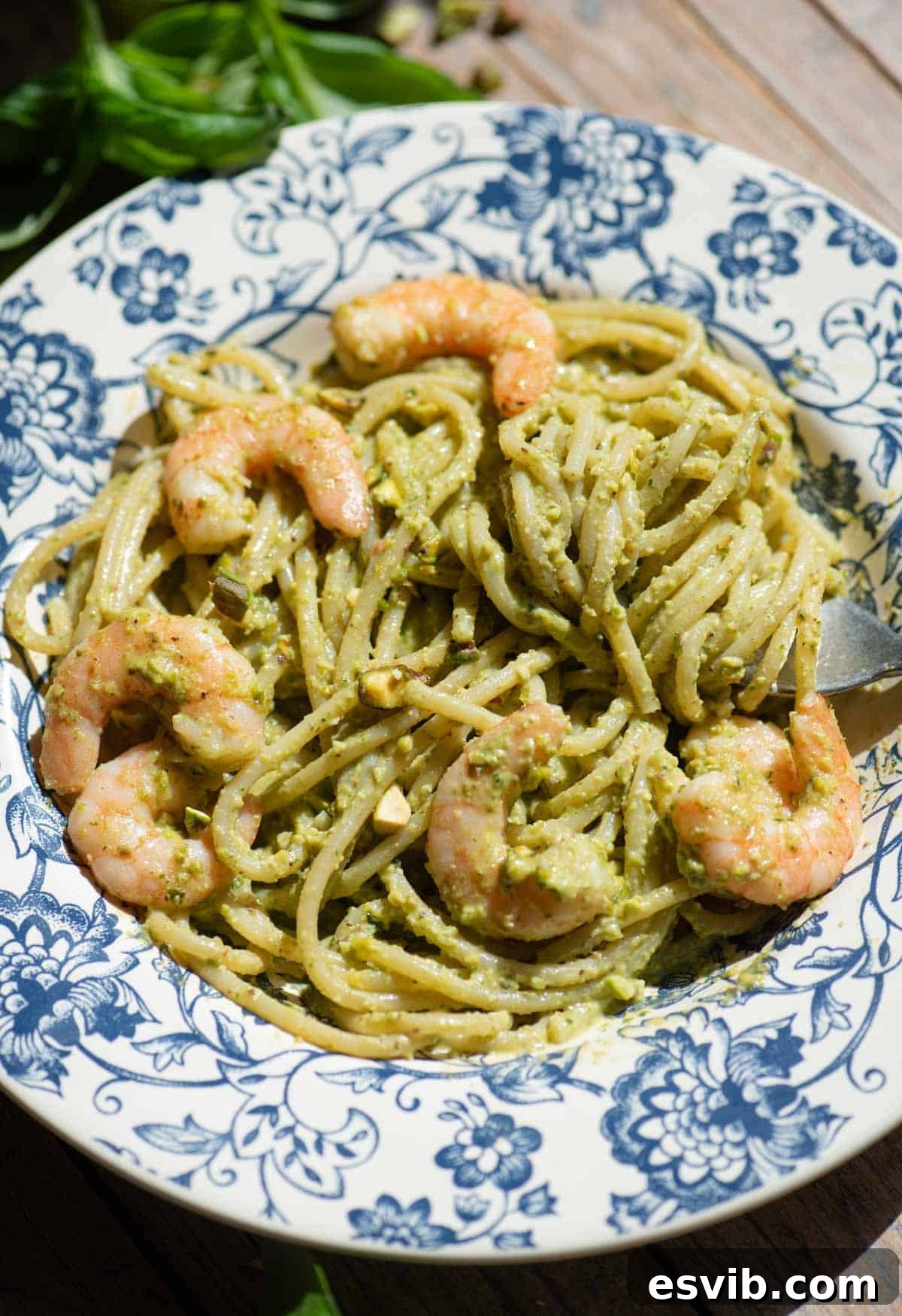 Emerald Coast Pistachio Shrimp Pasta 4 A side-angle shot of a bowl of Sicilian pistachio shrimp spaghetti, highlighting the creamy texture of the sauce and the juicy shrimp.
