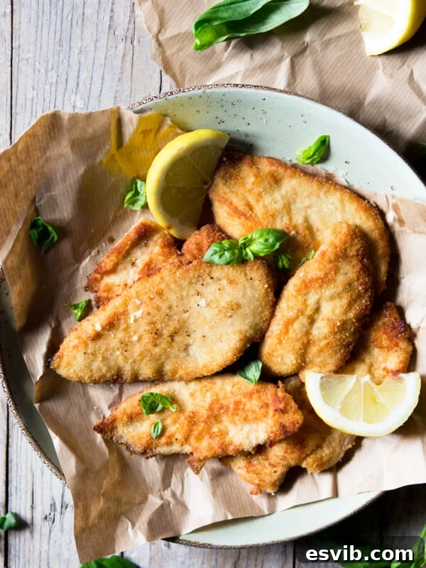 An overhead shot of breaded chicken cutlets
