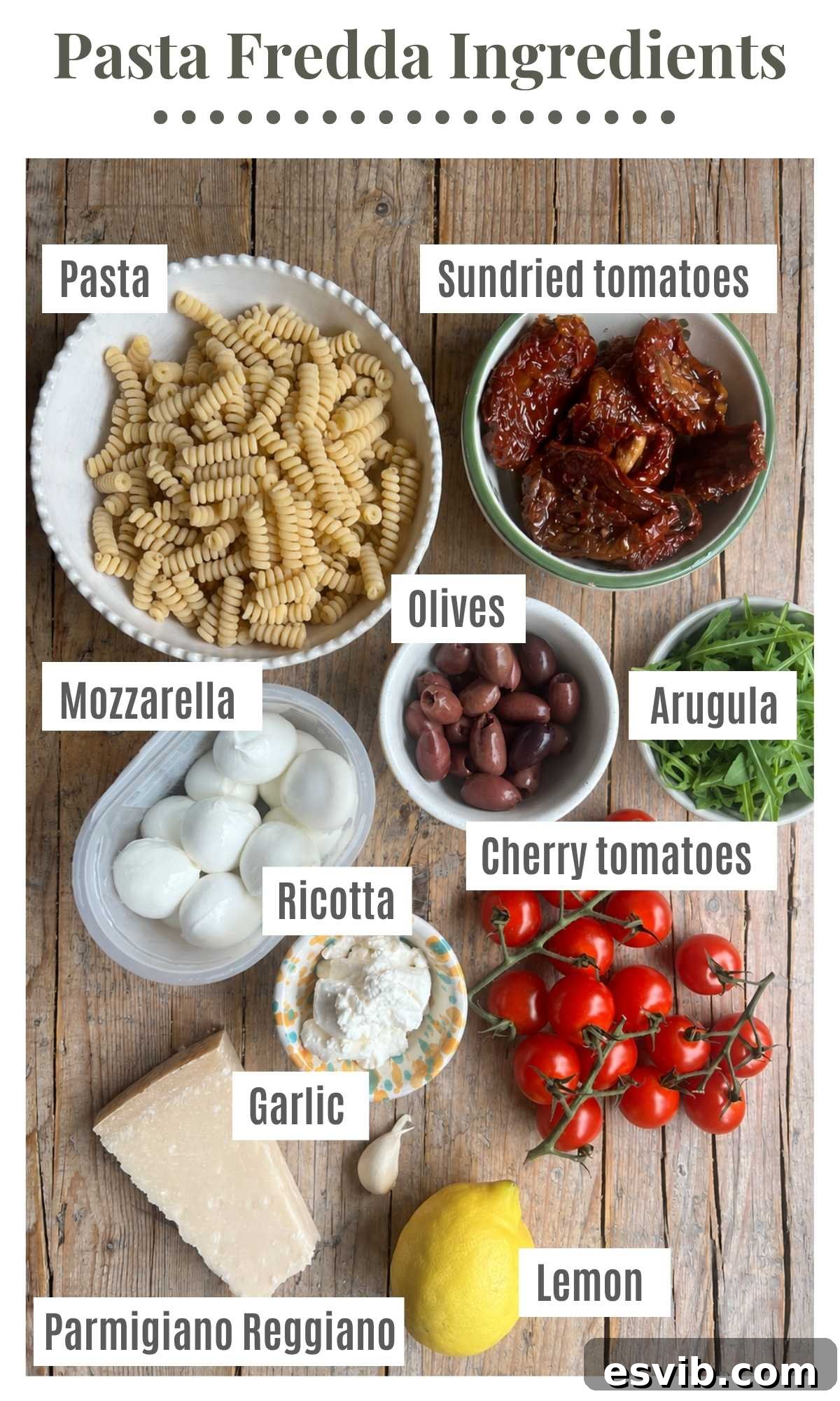 An overhead shot of all the ingredients needed to make a sundried tomato pasta salad.