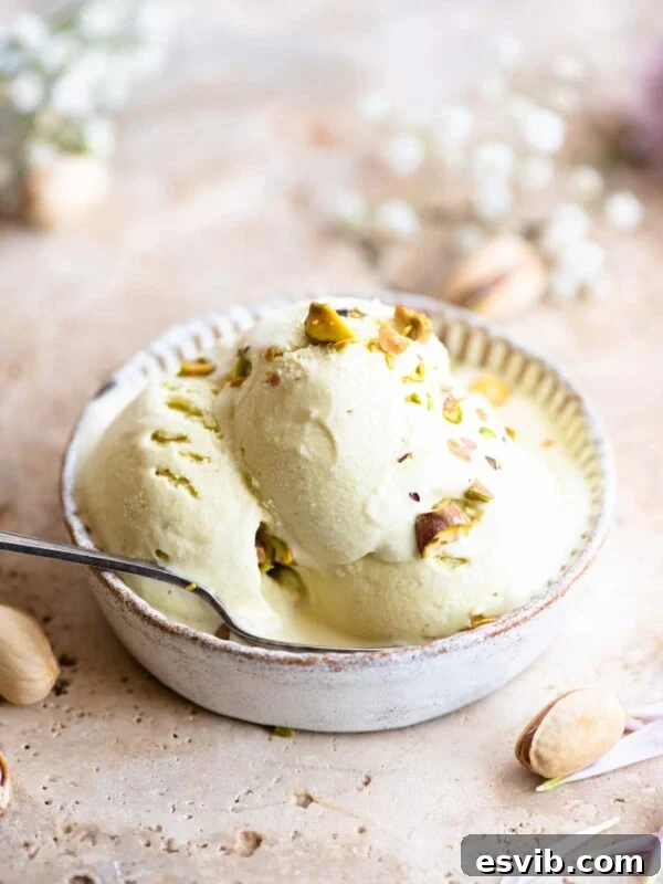 Three scoops of pistachio ice cream in a rustic looking ramekin
