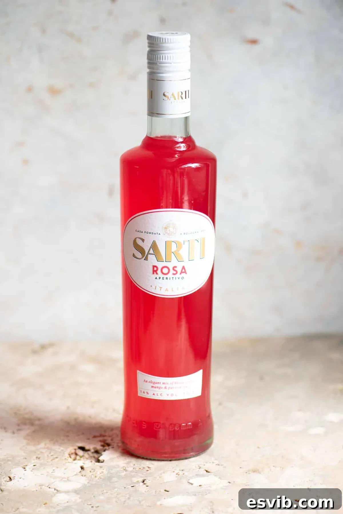 Sarti Spritz Fruity Italian Aperitif Cocktail 3 A bottle of Sarti liqueur on a neutral background.