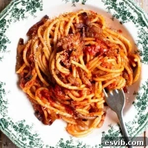 A close up cropped image of past al rancetto with tomato, pancetta and onion.
