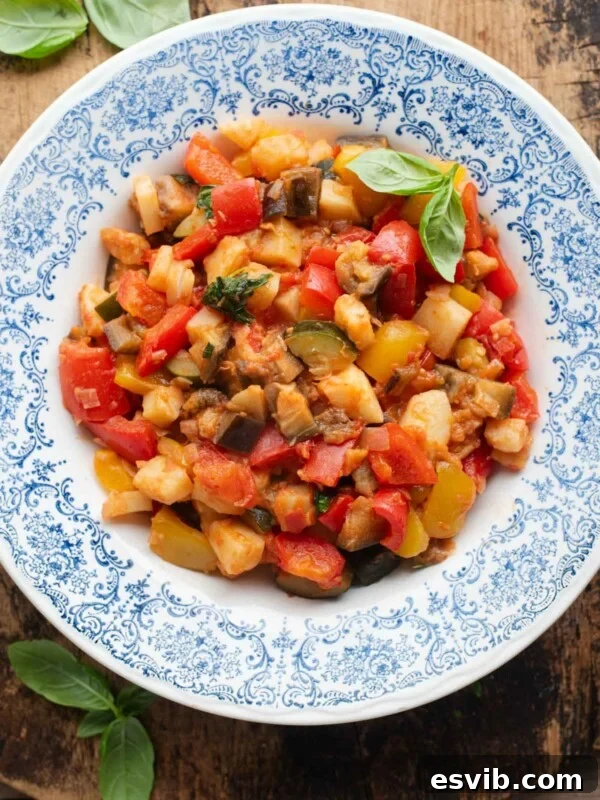 Ciambotta (Italian vegetable stew) in a blue bowl.